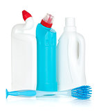 Plastic bottles of cleaning products and brush
