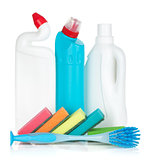 Plastic bottles of cleaning products, sponges and brush