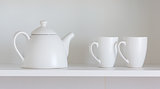 teapot and cups on the shelf
