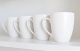 white cups on the shelf