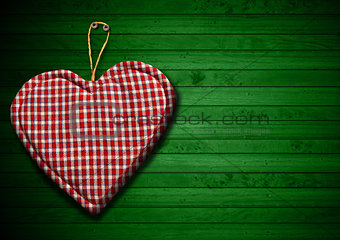 Cloth Heart on Green Wood Background