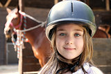 Little girl and brown Horse