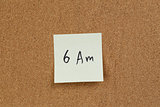 6am reminder note on cork board
