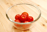 Fresh red tomatoes in a glass bowl