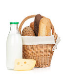 Picnic basket with bread, cheese and milk bottle