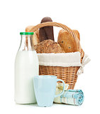 Picnic basket with bread and milk bottle