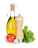 Fresh herbs, tomato, olive oil and pepper shaker