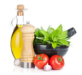 Fresh herbs, olive oil and pepper shaker