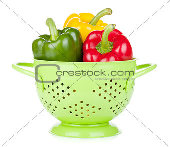 Fresh ripe bell peppers in colander