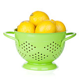 Fresh ripe lemons in colander