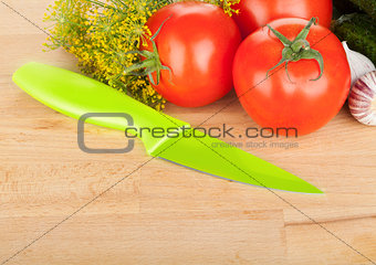 Ripe vegetables and knife
