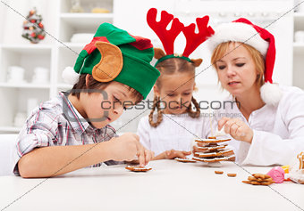 Kids decorating gingerbread cookies