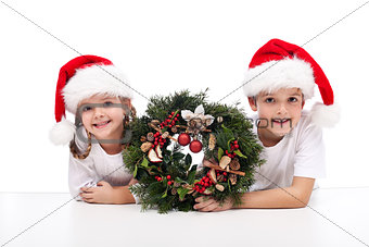 Kids with traditional advent wreath