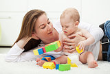 Baby boy playing with colorful blocks