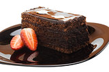 A piece of chocolate cake on a plate with strawberries