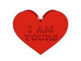 Big red heart. Phrase I AM YOURS cutout inside.