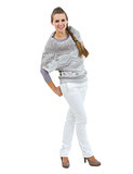 Full length portrait of happy young woman in sweater