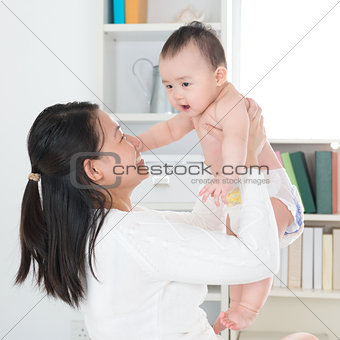 Asian mother and baby at home.