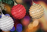 Christmas baubles on background of defocused  lights