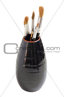 Vase with brushes of the artist