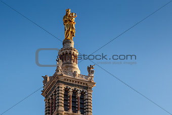 Golden Statue of the Madonna Holding the little Jesus on the top