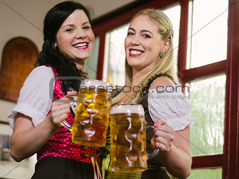 Gorgeous Oktoberfest waitresses with beer