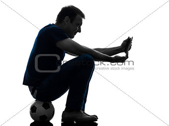man holding watching digital tablet  silhouette