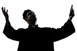 man priest praying silhouette