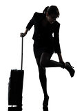 business woman traveling massaging feet silhouette