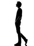 young man silhouette walking happy smiling