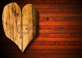Wooden Heart on Brown Wood Background