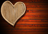 Wooden Heart on Brown Wood Background