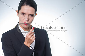 Stern young woman making a finger gesture