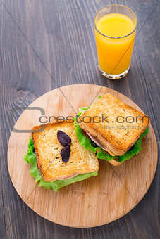 Sandwich with ham, cheese, tomatoes and lettuce
