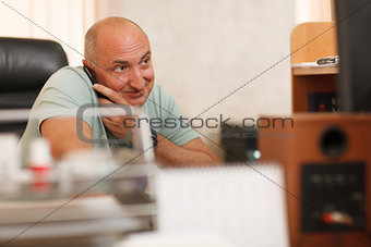 Middle-aged businessman on the phone