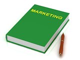 Green book on marketing and pen 