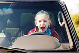 Crying scared girl in the car
