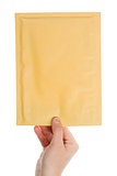 Yellow envelope in the hand 