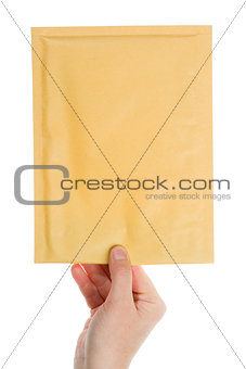 Yellow envelope in the hand 