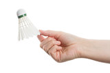 Hand holding white badminton shuttlecock