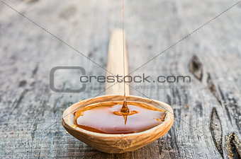 Honey in a wooden spoon