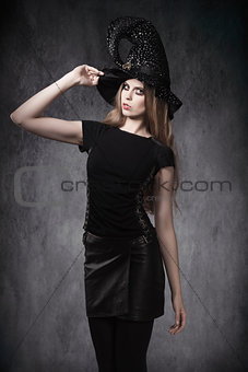 sensual Halloween girl with witch hat 