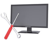 Monitor, a screwdriver and a wrench