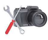 SLR camera, a screwdriver and a wrench