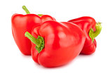 Three red sweet peppers