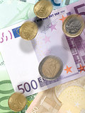 Flying coins.Money background from euro banknotes and coins