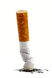 Cigarette butt with ash over white background