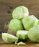 ripe white cabbage on a wooden table