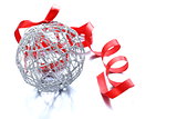 silver Christmas ball (decoration) with a red ribbon