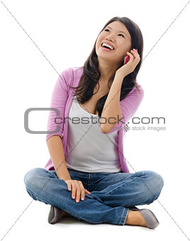 Asian woman talking on smartphone